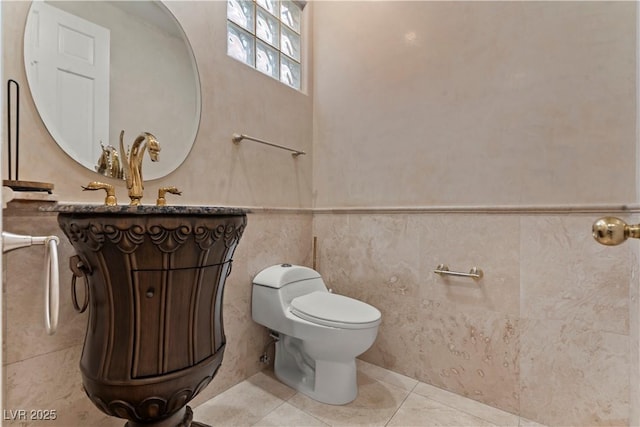 8215 Crow Valley Ln, Las Vegas, NV 89113 - half bath with tile patterned flooring, vanity, wainscoting, and tile walls