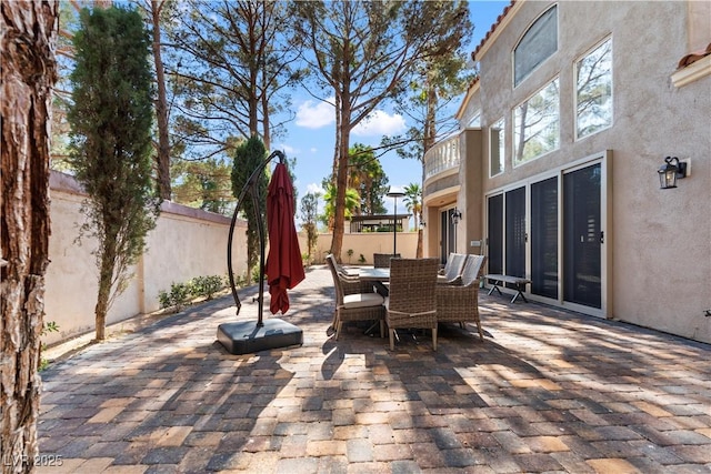 8215 Crow Valley Ln, Las Vegas, NV 89113 - fenced backyard featuring outdoor dining area and a patio