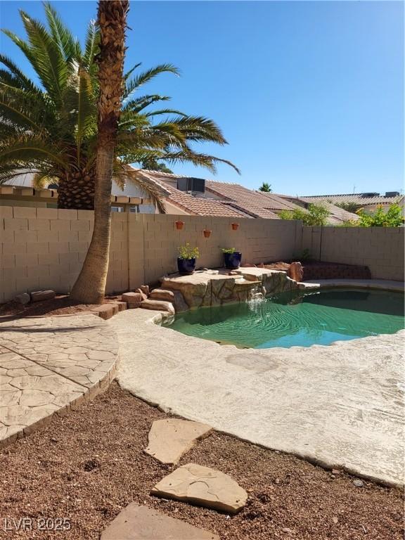 8712 Texas Bronco Ave, Las Vegas, NV 89129 - view of swimming pool featuring a fenced backyard and a patio area