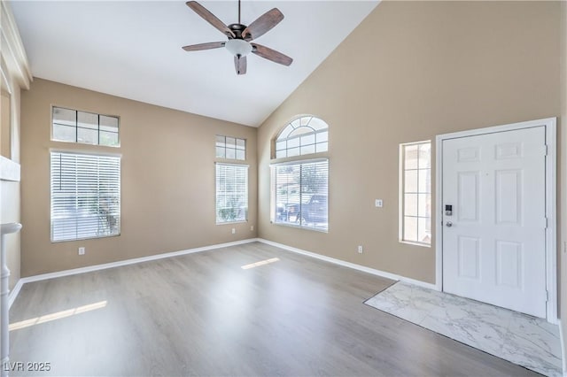 8712 Texas Bronco Ave, Las Vegas, NV 89129 - entryway with high vaulted ceiling, ceiling fan, and wood finished floors
