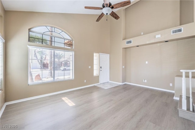 8712 Texas Bronco Ave, Las Vegas, NV 89129 - entrance foyer featuring light wood finished floors, ceiling fan, and high vaulted ceiling