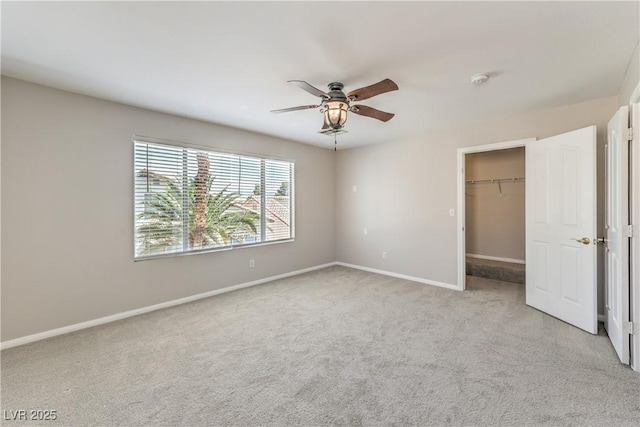 8712 Texas Bronco Ave, Las Vegas, NV 89129 - unfurnished bedroom featuring light carpet, a spacious closet, ceiling fan, and a closet