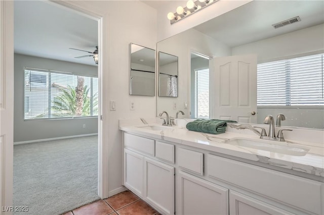 8712 Texas Bronco Ave, Las Vegas, NV 89129 - bathroom featuring double vanity, ceiling fan, and tile patterned floors