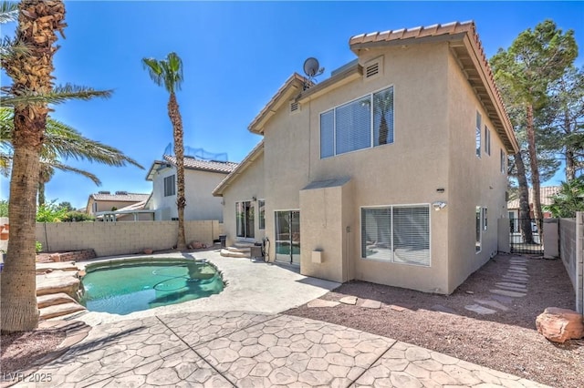 8712 Texas Bronco Ave, Las Vegas, NV 89129 - rear view of house with stucco siding, a fenced backyard, a patio area, and entry steps