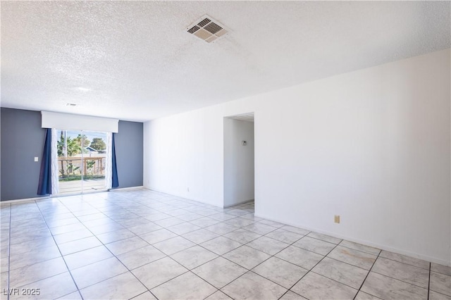 5673 Coaldale Pl, Las Vegas, NV 89110 - spare room with a textured ceiling and light tile patterned floors