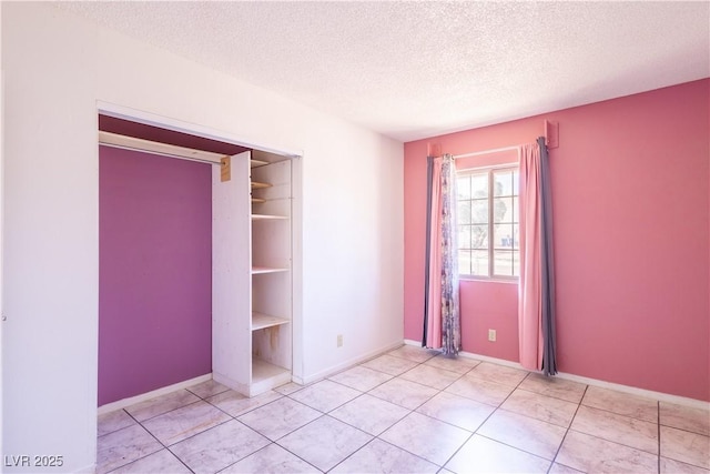 5673 Coaldale Pl, Las Vegas, NV 89110 - tiled empty room with a textured ceiling and baseboards