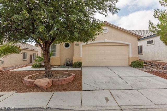 10243 Songsparrow Ct, Las Vegas, NV 89135 - view of front of house with stucco siding, concrete driveway, and a garage