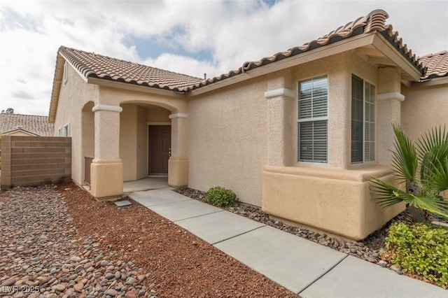10243 Songsparrow Ct, Las Vegas, NV 89135 - entrance to property with a tiled roof and stucco siding