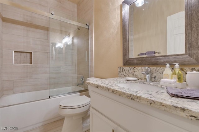10243 Songsparrow Ct, Las Vegas, NV 89135 - full bathroom featuring vanity, a textured wall, and combined bath / shower with glass door