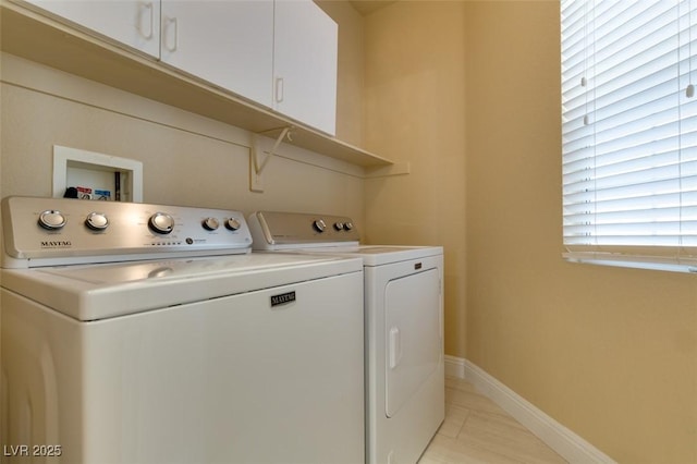 10243 Songsparrow Ct, Las Vegas, NV 89135 - washroom with separate washer and dryer, cabinet space, and light tile patterned flooring