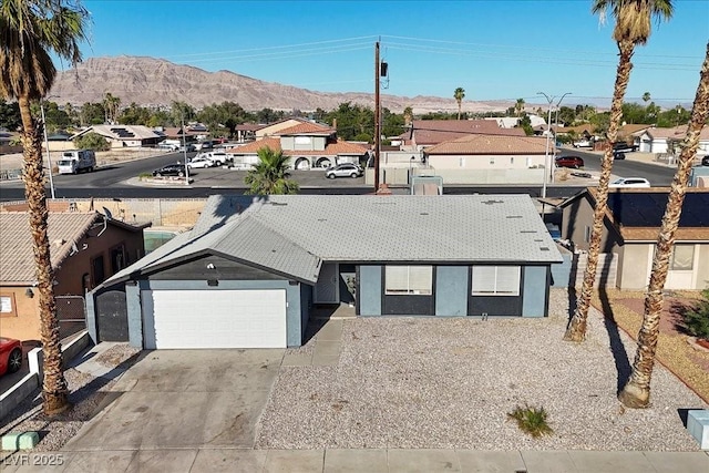 2088 Miner Way, Las Vegas, NV 89104 - view of front of home featuring a mountain view, a residential view, and driveway