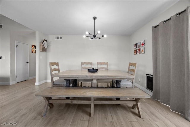 2088 Miner Way, Las Vegas, NV 89104 - dining space with light wood-style floors and a chandelier