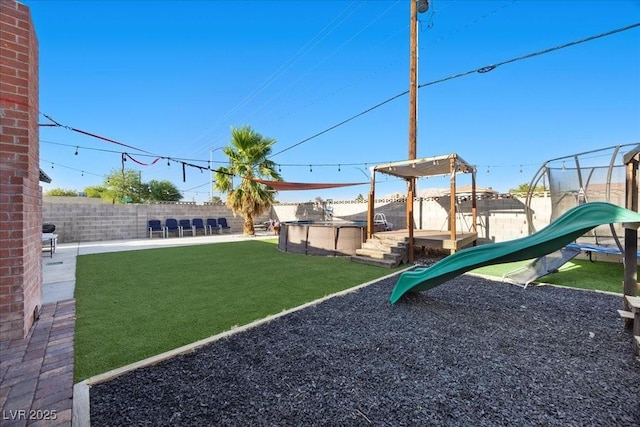 2088 Miner Way, Las Vegas, NV 89104 - fenced backyard with a playground and a trampoline