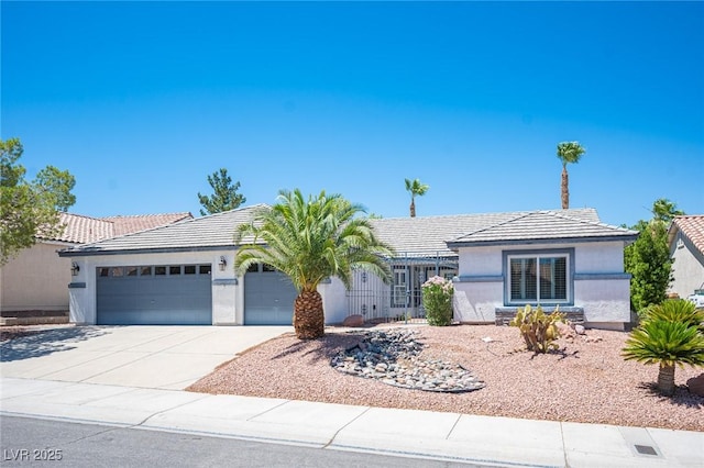 9728 Drumcannon Ave, Las Vegas, NV 89129 - single story home featuring a garage, stucco siding, a tiled roof, and driveway