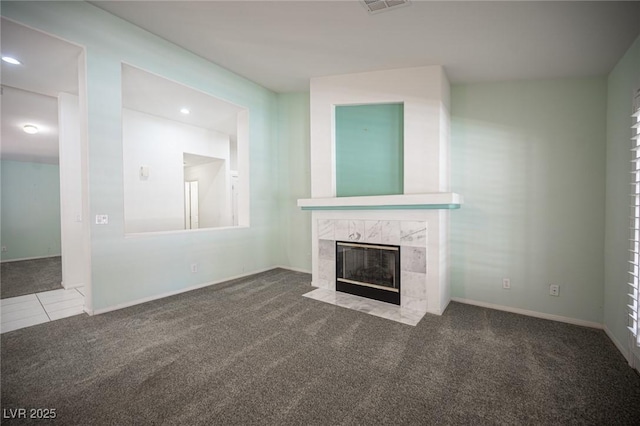 9728 Drumcannon Ave, Las Vegas, NV 89129 - unfurnished living room with carpet flooring, a fireplace, recessed lighting, and tile patterned floors