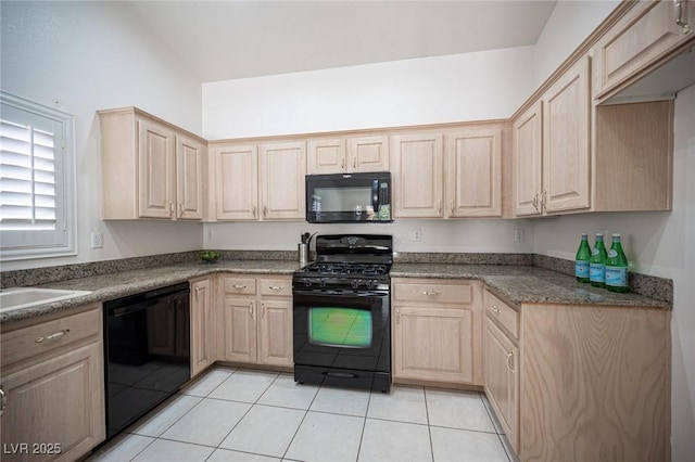 9728 Drumcannon Ave, Las Vegas, NV 89129 - kitchen with black appliances, light brown cabinetry, and light tile patterned floors