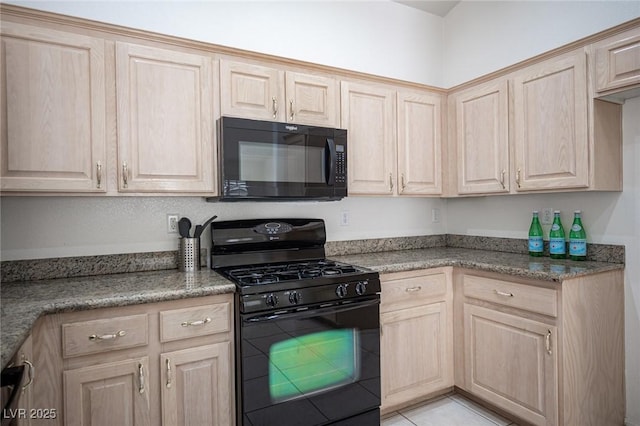 9728 Drumcannon Ave, Las Vegas, NV 89129 - kitchen with black appliances, light brown cabinets, light tile patterned floors, and light stone countertops