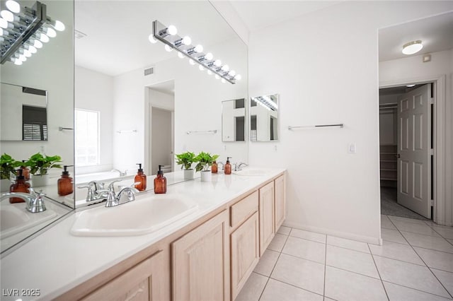 9728 Drumcannon Ave, Las Vegas, NV 89129 - bathroom with double vanity, tile patterned flooring, and a garden tub