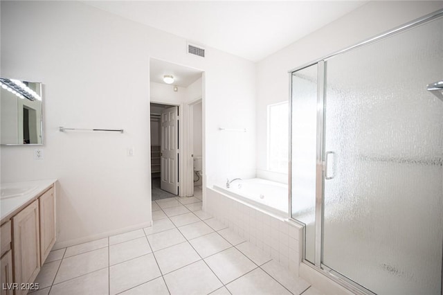 9728 Drumcannon Ave, Las Vegas, NV 89129 - bathroom featuring vanity, a bath, a stall shower, and tile patterned floors