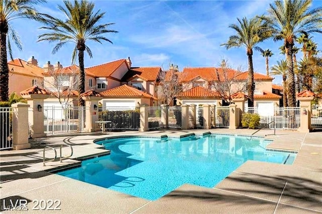 3111 Lido Isle Ct, Las Vegas, NV 89117 - community pool with a patio area and a residential view