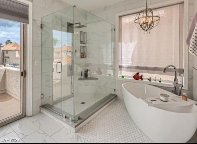 3111 Lido Isle Ct, Las Vegas, NV 89117 - bathroom featuring a freestanding tub, a shower stall, marble finish floors, a chandelier, and connected bathroom