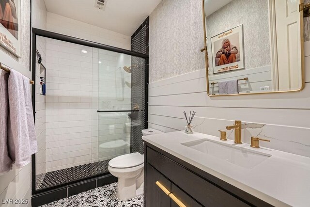 3111 Lido Isle Ct, Las Vegas, NV 89117 - bathroom featuring vanity, a shower stall, tile patterned floors, and a wainscoted wall