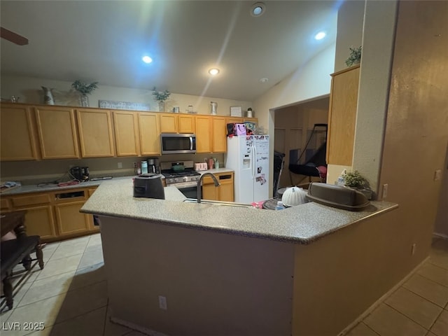 8277 Orange Vale Ave, Las Vegas, NV 89131 - kitchen with appliances with stainless steel finishes, light tile patterned floors, light countertops, lofted ceiling, and light brown cabinets