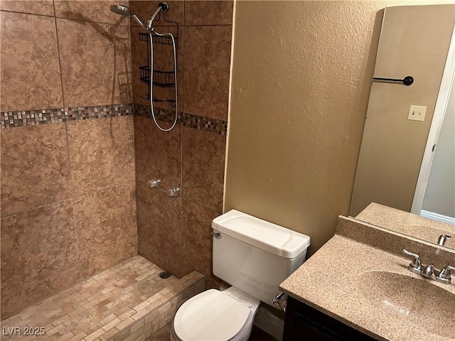 608 Watkins Dr, Las Vegas, NV 89107 - bathroom featuring a tile shower and vanity