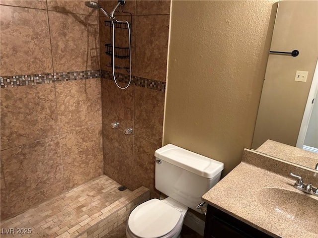 608 Watkins Dr, Las Vegas, NV 89107 - bathroom with a tile shower and vanity