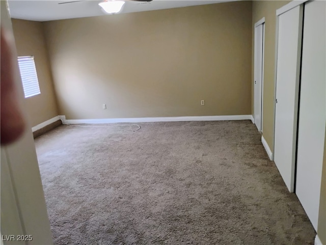 608 Watkins Dr, Las Vegas, NV 89107 - unfurnished bedroom featuring carpet flooring, multiple closets, and a ceiling fan