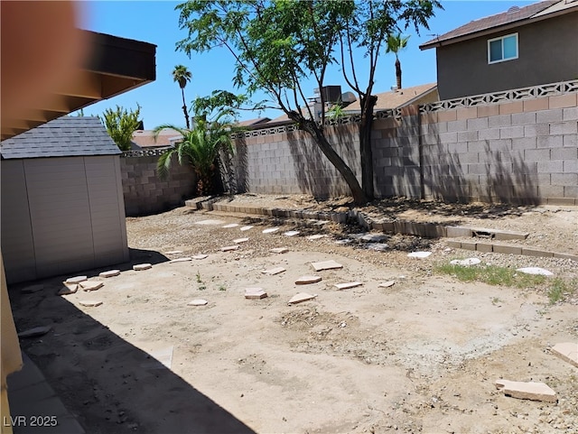 608 Watkins Dr, Las Vegas, NV 89107 - fenced backyard featuring a storage shed
