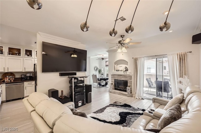 2050 W Warm Springs Rd Unit 3624, Henderson, NV 89014 - living room featuring ceiling fan, light wood-style flooring, and a tiled fireplace