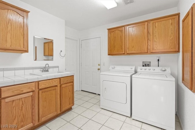 5981 Doubletree Rd, Pahrump, NV 89061 - laundry area with independent washer and dryer, cabinet space, and light tile patterned floors