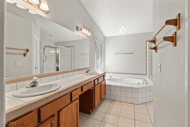 5981 Doubletree Rd, Pahrump, NV 89061 - bathroom with double vanity, a stall shower, tile patterned floors, and a bath
