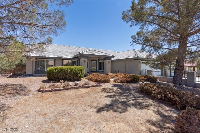 5981 Doubletree Rd, Pahrump, NV 89061 - single story home with a tiled roof and stucco siding