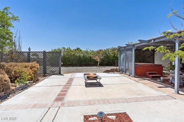 5981 Doubletree Rd, Pahrump, NV 89061 - view of patio / terrace featuring a hot tub and an outdoor fire pit