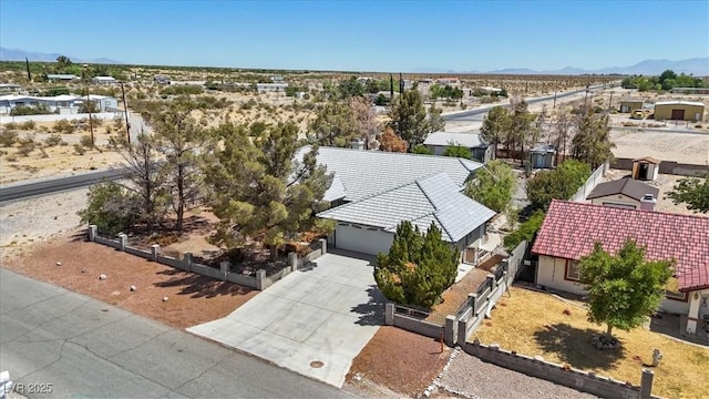 5981 Doubletree Rd, Pahrump, NV 89061 - aerial perspective of suburban area featuring a mountainous background