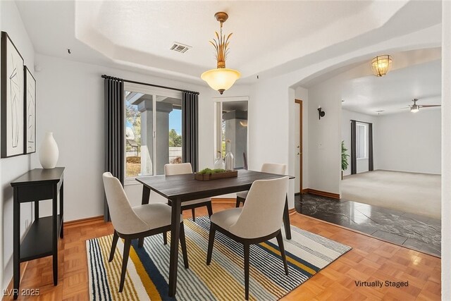 5981 Doubletree Rd, Pahrump, NV 89061 - dining space with a tray ceiling and arched walkways