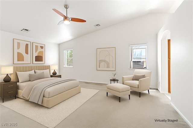 5981 Doubletree Rd, Pahrump, NV 89061 - carpeted bedroom with vaulted ceiling, ceiling fan, and arched walkways