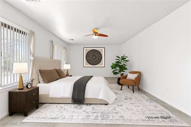 5981 Doubletree Rd, Pahrump, NV 89061 - carpeted bedroom with baseboards and a ceiling fan