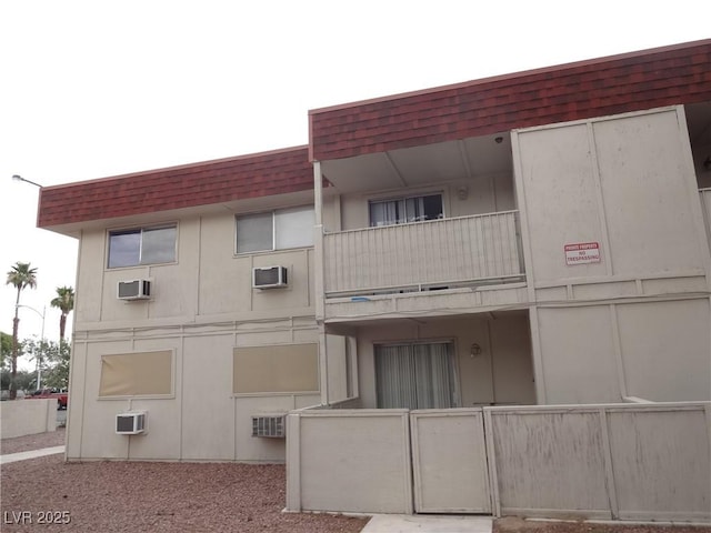 5388 Swenson St Unit 26, Las Vegas, NV 89119 - view of property featuring a wall mounted air conditioner