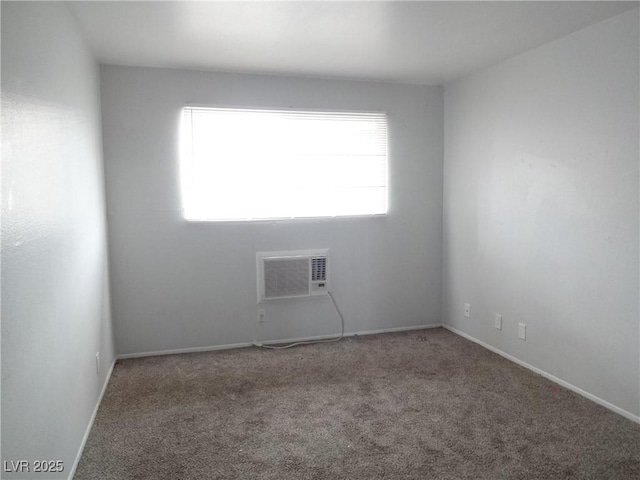 5388 Swenson St Unit 26, Las Vegas, NV 89119 - unfurnished room featuring carpet floors and a wall mounted air conditioner