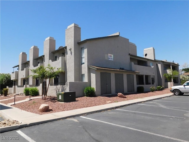 2921 Country Manor Ln Unit 139, Las Vegas, NV 89115 - view of building exterior featuring uncovered parking