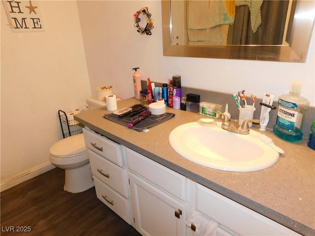 2921 Country Manor Ln Unit 139, Las Vegas, NV 89115 - half bathroom featuring vanity and wood finished floors