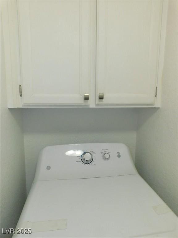 2921 Country Manor Ln Unit 139, Las Vegas, NV 89115 - laundry area featuring washer / clothes dryer and cabinet space