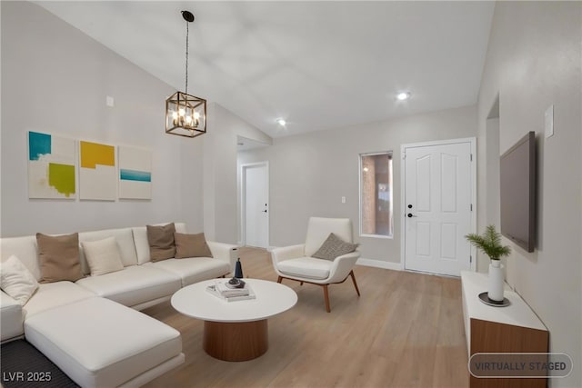 9513 Yucca Blossom Dr, Las Vegas, NV 89134 - living room featuring light wood-style flooring, a chandelier, high vaulted ceiling, and recessed lighting