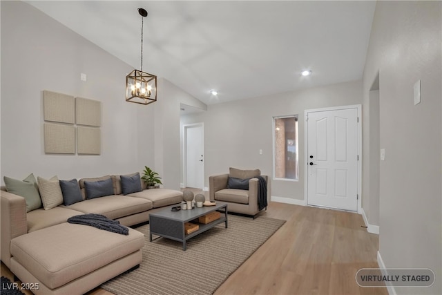9513 Yucca Blossom Dr, Las Vegas, NV 89134 - living room with light wood-type flooring, a chandelier, vaulted ceiling, and recessed lighting