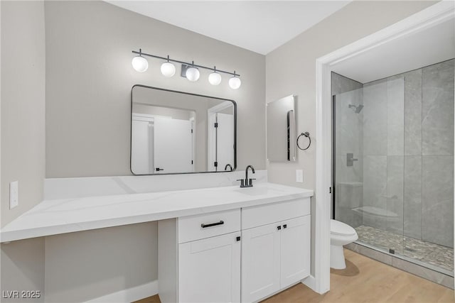 9513 Yucca Blossom Dr, Las Vegas, NV 89134 - bathroom with vanity, a shower stall, and wood finished floors