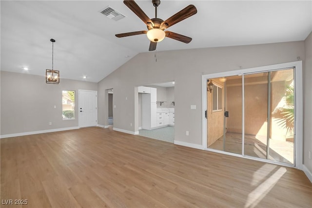 9513 Yucca Blossom Dr, Las Vegas, NV 89134 - unfurnished living room featuring ceiling fan, vaulted ceiling, and light wood finished floors