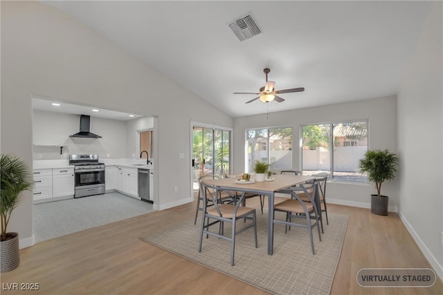 9513 Yucca Blossom Dr, Las Vegas, NV 89134 - dining area featuring light wood finished floors, lofted ceiling, and ceiling fan
